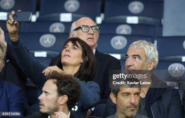 Estelle Denis take a selfie with his husband Raymond Domenech before the French Ligue 1 match between Paris Saint Germain and AS Saint-Etienne at...