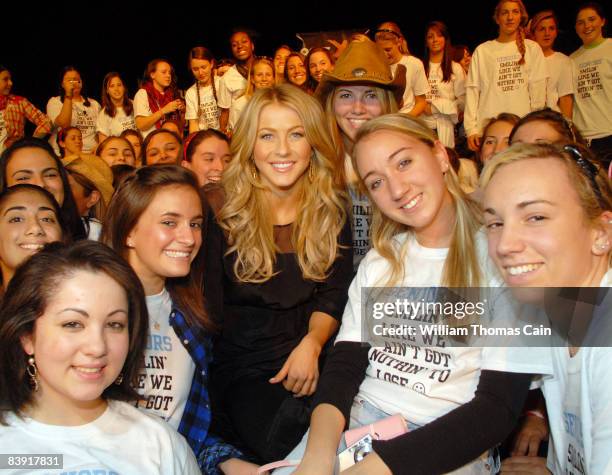 Singer and dancer Julianne Hough , formerly of "Dancing With The Stars" poses with some students at Merion Mercy Academy December 4, 2008 in Lower...