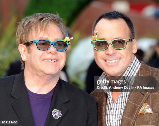 Sir Elton John and David Furnish, arrive for the premiere of Gnomeo and Juliet, an animated film produced by Sir Elton John and David Furnish, at the...