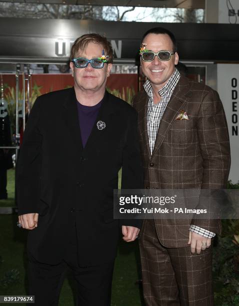 Sir Elton John and David Furnish arriving for the premiere of Gnomeo and Juliet at the Odeon Leicester Square, London.