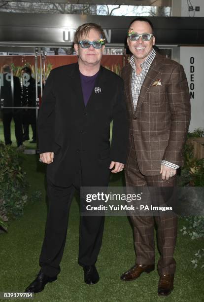 Sir Elton John and David Furnish arriving for the premiere of Gnomeo and Juliet at the Odeon Leicester Square, London.