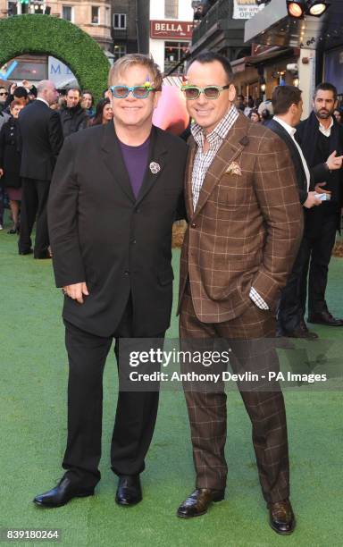 Sir Elton John and David Furnish, arrive for the premiere of Gnomeo and Juliet, an animated film produced by Sir Elton John and David Furnish, at the...