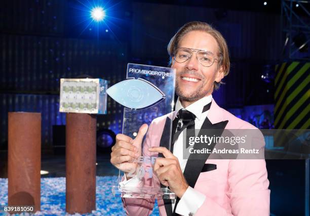 Winner 2017, Jens Hilbert, poses with the award during the finals of 'Promi Big Brother 2017' at MMC Studio on August 25, 2017 in Cologne, Germany.