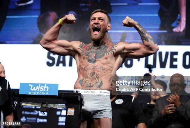 Figher Connor Mcgregor poses during a weigh- in on August 25 in Las Vegas, Nevada. Boxer Floyd Mayweather Jr., the 40-year-old undefeated former...