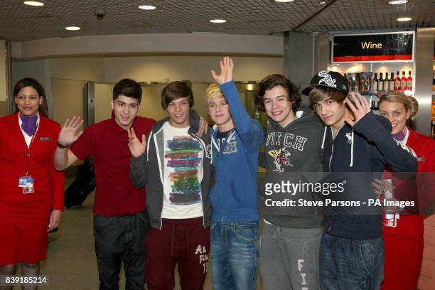 Factor boy band stars One Direction Zayn Malik, Louis Tomlinson, Niall Horan, Harry Styles and Liam Payne, as they arrive back from LA into Heathrow...