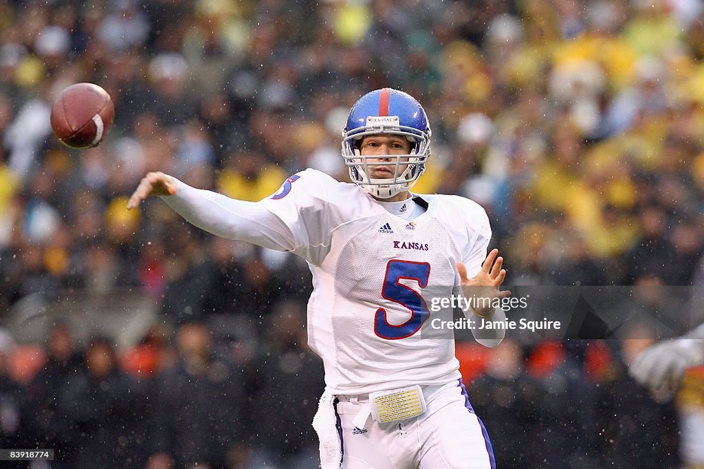 Todd Reesing Dimensional Todd Reesing of the Kansas Jayhawks passes the ball during the game ...