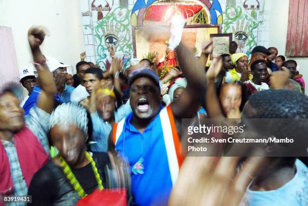 Cuban with the Santeria name Obba-Coto chants with others as cubans celebrate the anniversary of the Catholic Saint St. Barbara or the Afro-Cuban...