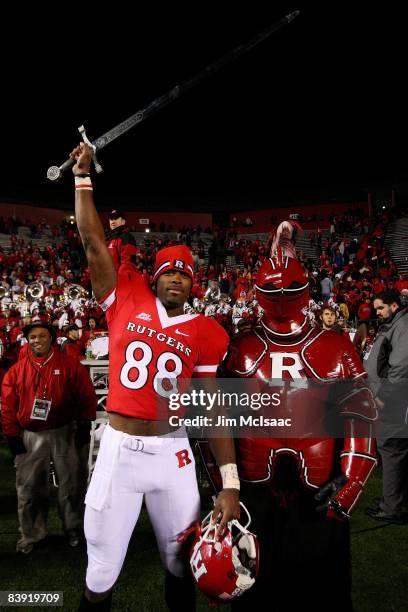 Kenny Britt of the Rutgers Scarlet Knights celebrates victory over the Louisville Cardinals at Rutgers Stadium on December 4, 2008 in Piscataway, New...