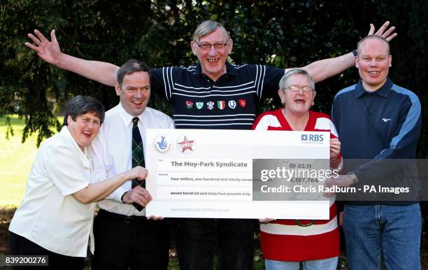 Lottery winners, from left, Christine Mowat, Andrew Mowat, John Bell, Chris Bell and Joe Burton celebrate sharing just over 4 million pounds in the...