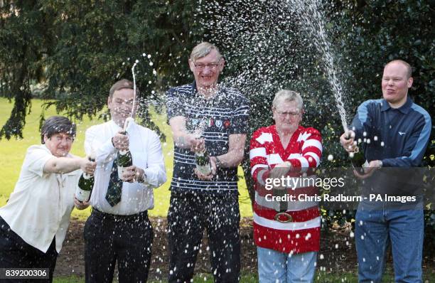 Lottery winners, from left, Christine Mowat, Andrew Mowat, John Bell, Chris Bell and Joe Burton celebrate sharing just over 4 million pounds in the...
