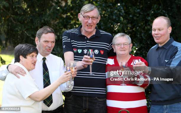 Lottery winners, from left, Christine Mowat, Andrew Mowat, John Bell, Chris Bell and Joe Burton celebrate sharing just over 4 million pounds in the...