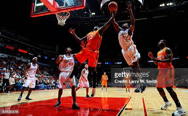David Monds the Albuquerque Thunderbirds goes for a rebound against Cartier Martin of the Iowa Energy on December 04, 2008 at Wells Fargo Arena in...