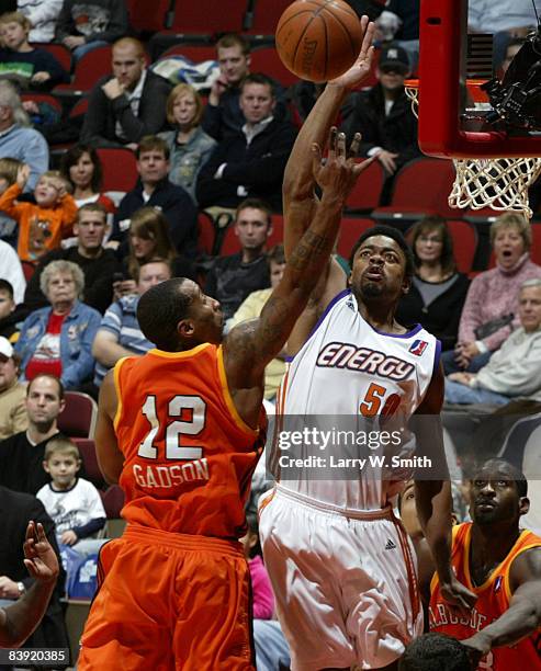 Cheyne Gadson of the Albuquerque Thunderbirds gets a shot blocked by Marvin Phillips of the Iowa Energy on December 04, 2008 at Wells Fargo Arena in...