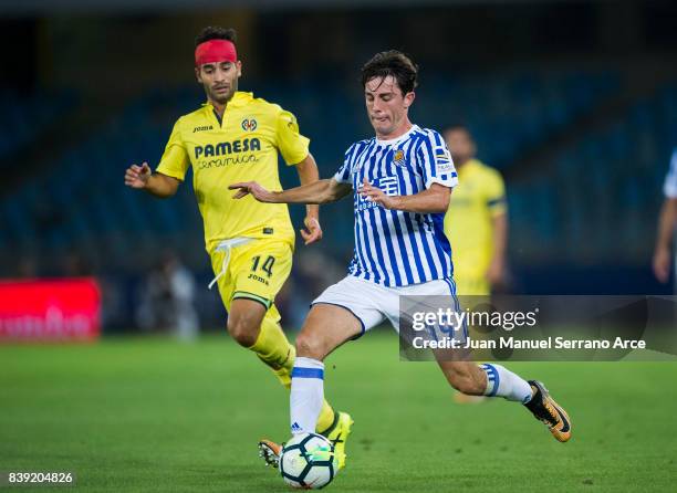 Ruben Pardo of Villarreal CF duels for the ball with Alvaro Odriozola of Real Sociedad during the La Liga match between Real Sociedad de Futbol and...