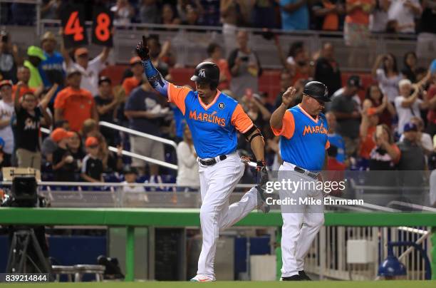 Giancarlo Stanton of the Miami Marlins hits a two run home run in the first inning during a game against the San Diego Padres at Marlins Park on...