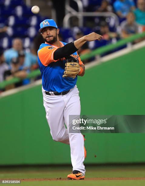 Mike Aviles of the Miami Marlins makes a throw to first during a game against the San Diego Padres at Marlins Park on August 25, 2017 in Miami,...