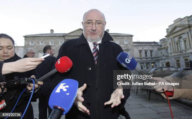 Sinn Fein TD Caoimhghin O Caolain gives his reaction to the Government's four year Budget Blueprint outside Leinster House in Dublin.