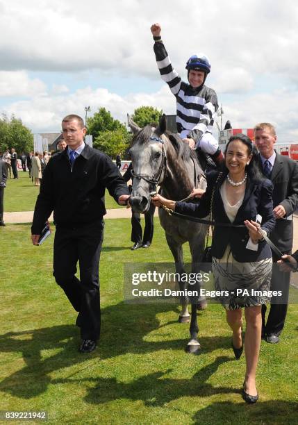 Lady O'Reilly and Kris Weld, son of trainer Dermot Weld lead Chinese White and jockey Pat Smullen in after winning the Audi Pretty Polly Stakes on...