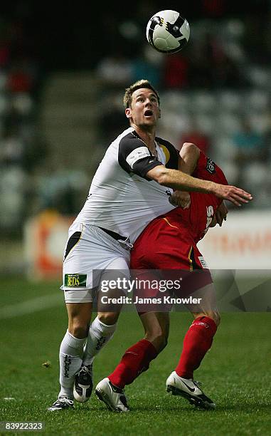 Shane Smeltz of the Phoenix is tackled by Travis Dodd of United during the round 14 A-League match between Adelaide United and the Wellington Phoenix...