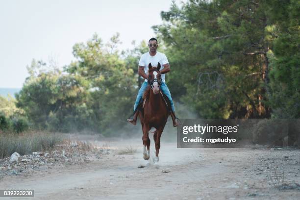 Man Riding Rocking Horse 45,501 Man Riding A Horse Stock Photos, High-Res Pictures, and Images ...