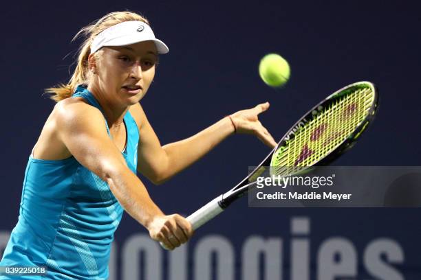 Daria Gavrilova of Australia returns a shot to Agnieszka Radwanska of Poland during Day 7 of the Connecticut Open at Connecticut Tennis Center at...