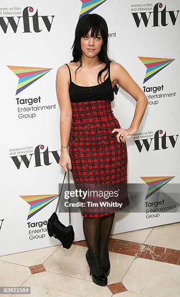 Lily Allen poses for photos before attending the Target Women in Film and Television Awards at the Hilton hotel on December 5, 2008 in London,...