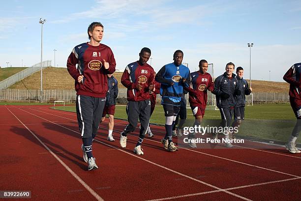 Ron-Robert Zieler of Northampton Town runs with his team-mates during a training session at the Sixfields Stadium on December 4, 2008 in Northampton,...