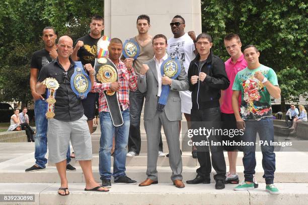 Boxers pose following a London news conference promoting a night of world championship boxing labelled The Magnificent Seven. From left: James...