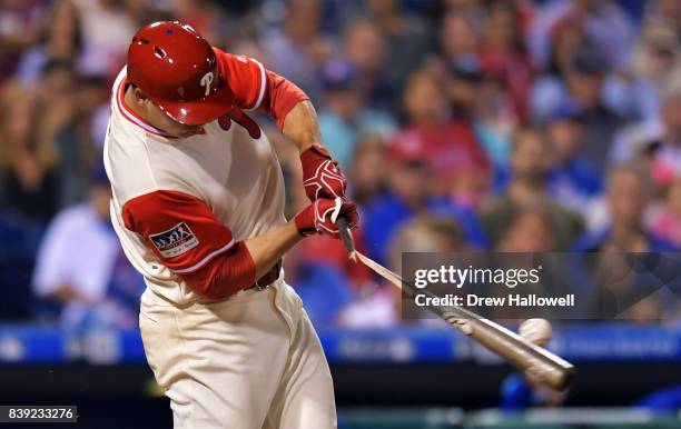 Jerad Eickhoff of the Philadelphia Phillies breaks his bat in the third inning against the Chicago Cubs at Citizens Bank Park on August 25, 2017 in...