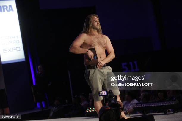 Model walks the runway during the NRA Concealed Carry Fashion Show on Friday, August 25, 2017 in Milwaukee, Wisconsin.