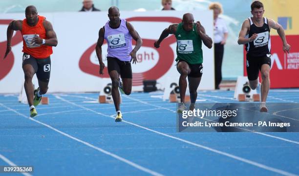 Cardiff's Christian Malcolm, Sheffield's Kim Collins, Manchester's Trell Kimmons and London's Tremayne Gilling during the mens' 100 metres during the...