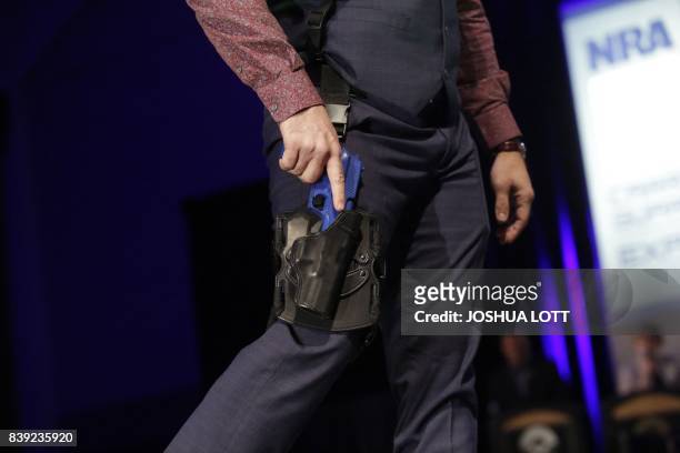 Model walks the runway during the NRA Concealed Carry Fashion Show on Friday, August 25, 2017 in Milwaukee, Wisconsin.