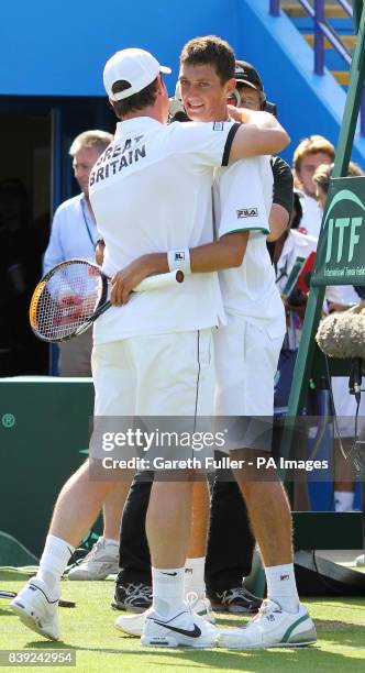 Great Britain's James Ward is congratulated by team captain Leon Smith after victory over Turkey's Marsel Ilhan during the Davis Cup at Devonshire...