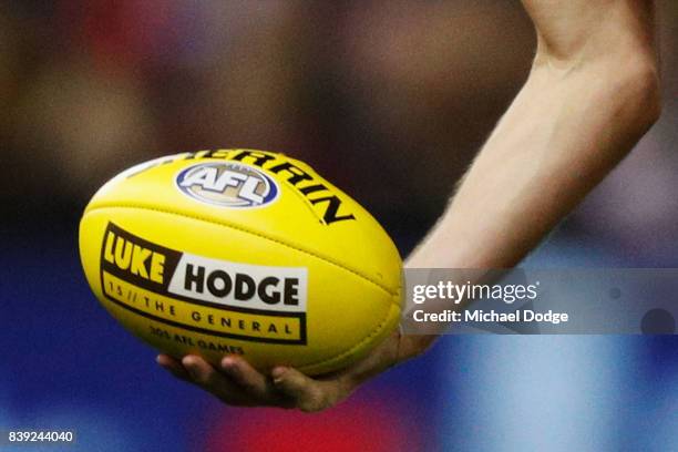 Luke Hodge of the Hawks holds the ball with his name on the football during round 23 AFL match between the Hawthorn Hawks and the Western Bulldogs at...