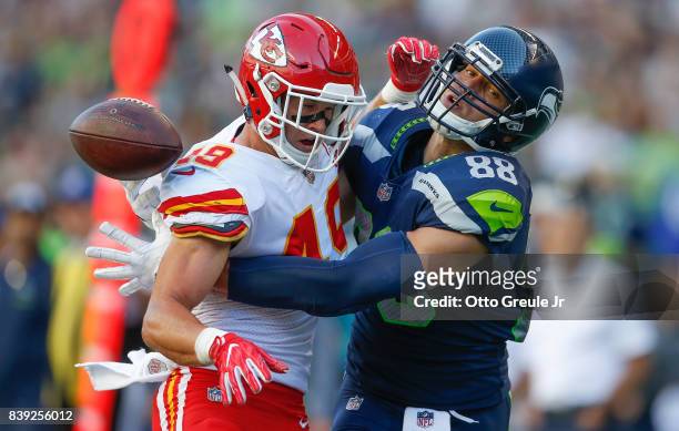Tight end Jimmy Graham of the Seattle Seahawks can't make the catch as defensive back Daniel Sorensen of the Kansas City Chiefs defends on the play...