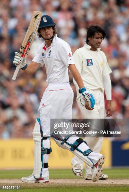 England's Alastair Cook salutes the crowd after reaching his half century during the third npower Test at The Brit Insurance Oval, London.