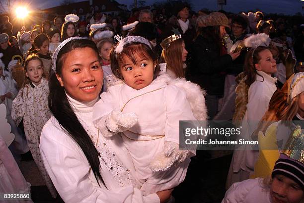 Children and young adults, dressed as Christmas angels gather near the Neuburg Christmas market on December 5, 2008 in Neuburg an der Donau, Germany....
