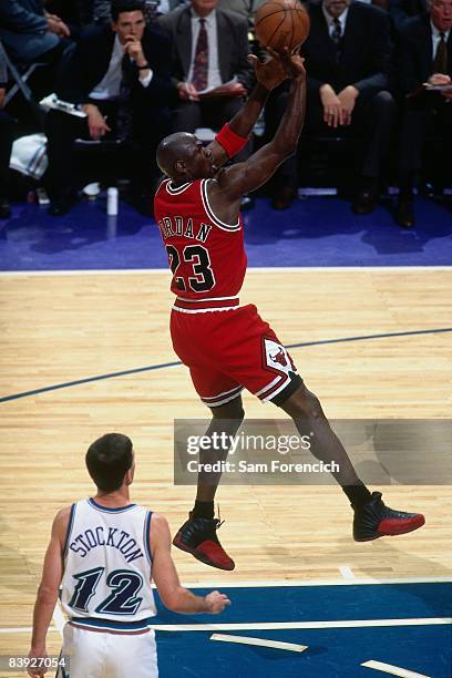 Michael Jordan of the Chicago Bulls shoots a jumper against John Stockton of the Utah Jazz in Game Three of the 1997 NBA Finals at the Delta Center...