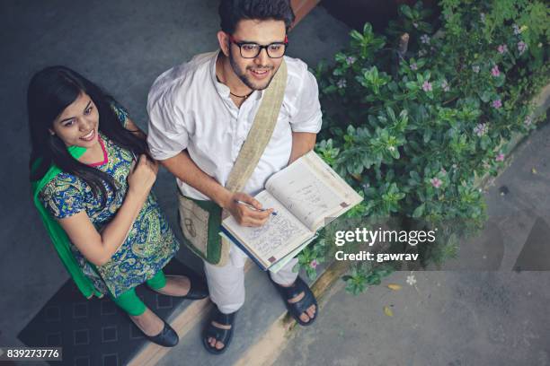 happy young adult students standing in porch together - reading glasses top view stock pictures, royalty-free photos & images