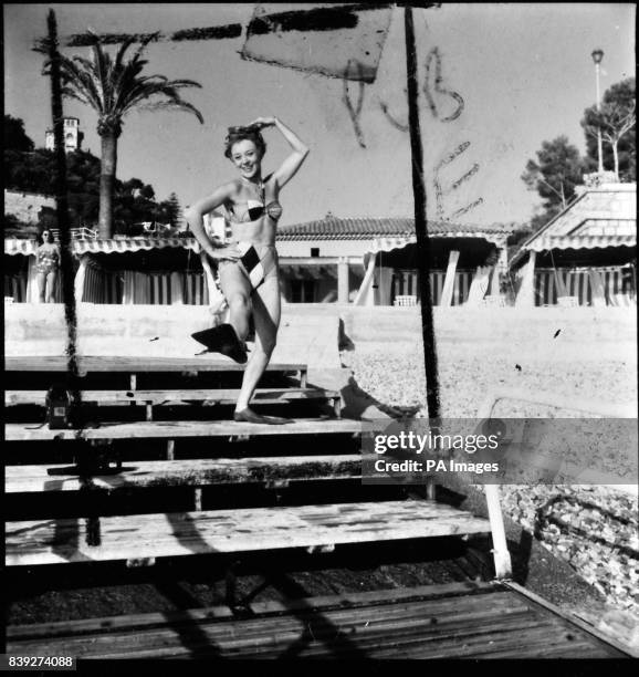 After making two films wearing a mermaid's tail, actress Glynis Johns takes to flippers for a change. She is pictured on location in Monte Carlo for...