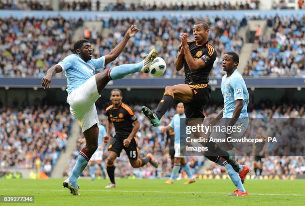 Chelsea's Ashley Cole and Manchester City's Kolo Toure battle for the ball