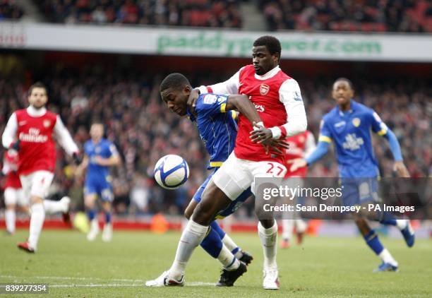 Arsenal's Emmanuel Eboue and Leeds United's Max Gradel battle for the ball.