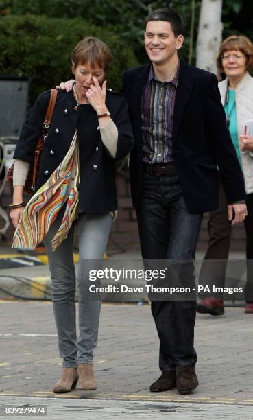 David Miliband arrives with his wife Louise Shackelton at the Manchester Conference Centre, Manchester, before the announcement of the new Labour...