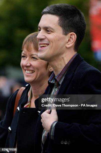 David Miliband arrives with his wife Louise Shackelton at the Manchester Conference Centre, Manchester, before the announcement of the new Labour...