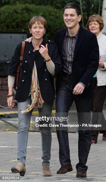 David Miliband arrives with his wife Louise Shackelton at the Manchester Conference Centre, Manchester, before the announcement of the new Labour...