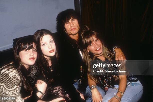 Daughters Mia and Liv, father Steven, and wife Teresa Barrick find some down time at Club USA in New York, 1993.
