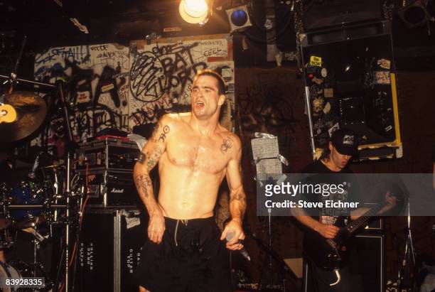 Hardcore punk musician Henry Rollins of the Rollins Band during a set on the cramped stage of CBGB's, 1992. New York, United States.