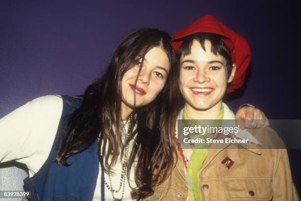 Heather Grody and Leisha Hailey of alternative rock group The Murmurs smile while at Club USA in New York, 1993.