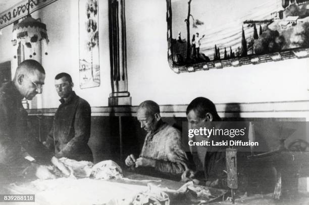 Prisoners working in the taylor's workshop in the Vorkuta Gulag , one of the major Soviet labor camps, Russia, Komi Republic, 1945.