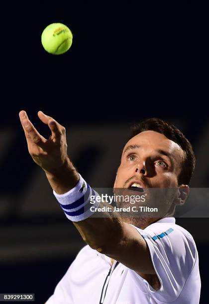 Roberto Bautista Agut of Spain serves to Jan-Lennard Struff of Germany during their semifinals match in the Winston-Salem Open at Wake Forest...